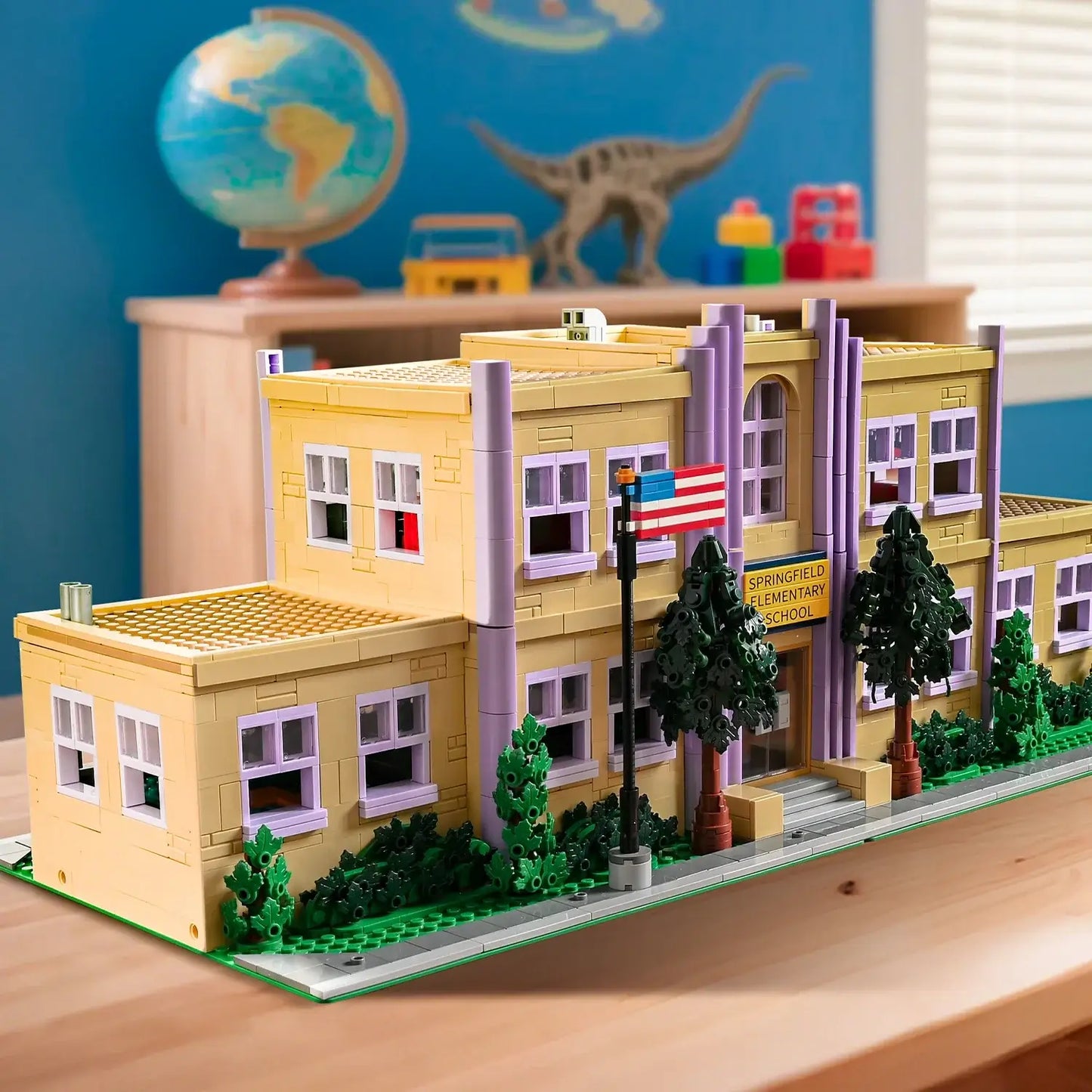 Springfield School Building Blocks Set displayed on a table, showcasing detailed architecture with trees and a flag.