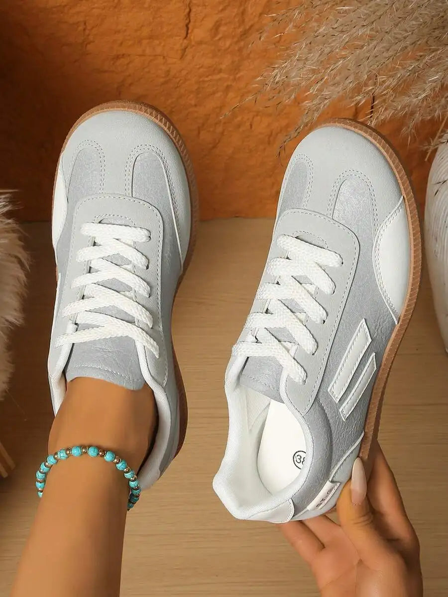 CNUO Casual Flat Sneakers With White Stripes For Women.